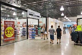 People walking in a mall Description automatically generated