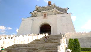 A white building with a large archway with Chiang Kai-shek Memorial Hall in the background
Description automatically generated with medium confidence