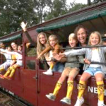 A group of people on a train Description automatically generated