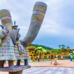A statue of a cow with horns Description automatically generated
