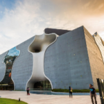 A building with a curved roof Description automatically generated with medium confidence