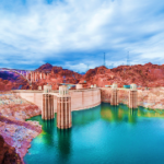 A large dam surrounded by water Description automatically generated