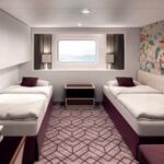 A room with two beds and a window AI-generated content may be incorrect.