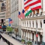A street with flags on the side of a building Description automatically generated